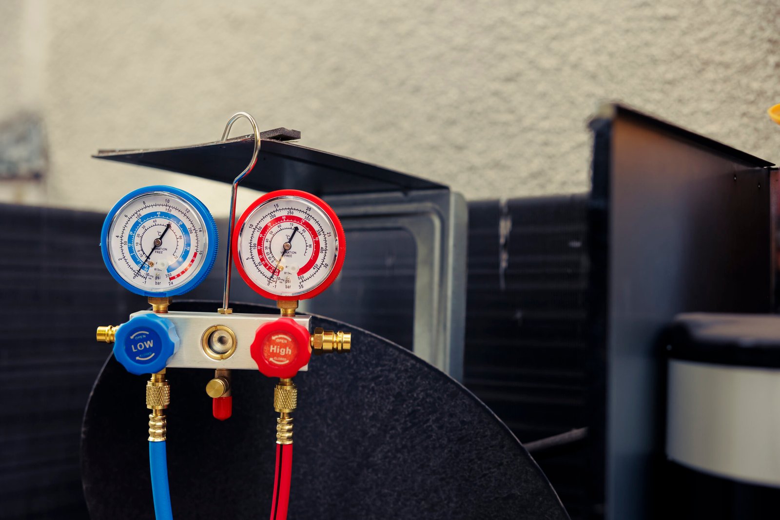 close up refrigerant manifold gauges scaled